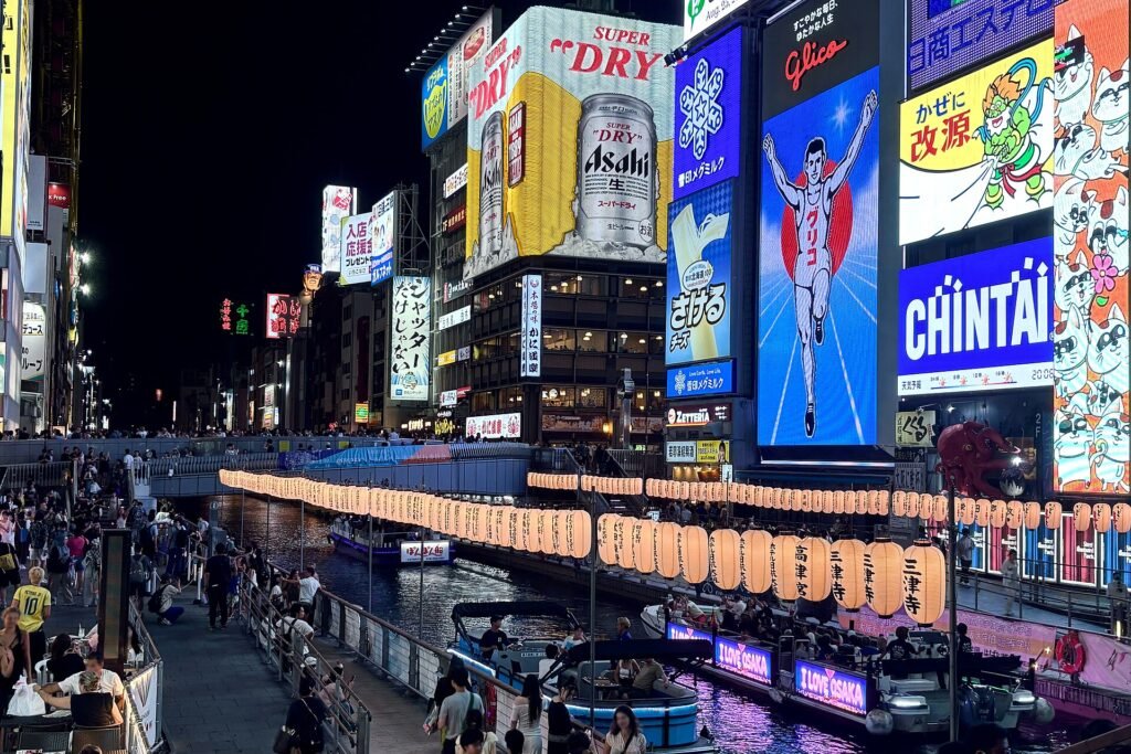 Dotonbori canal in Osaka at night with neon signs reflected in the water